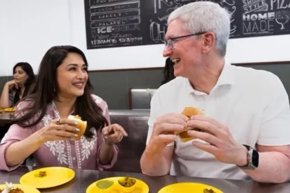 apple-store-launch-tim-cook-eats-vada-pav-with-madhuri-dixit-bollywood-celebs-pose-with-the-ceo