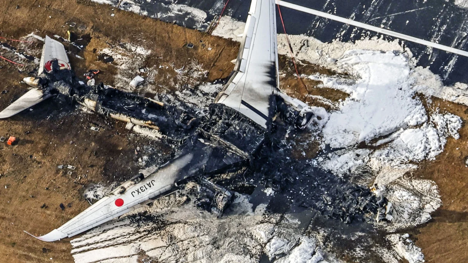 crews-at-haneda-airport-begin-clearing-plane-wreckage-from-japan-runway-collision